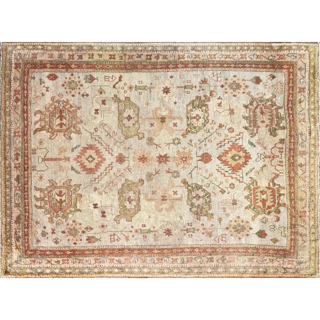 Step into the past with a captivating masterpiece for your floor - the c-1880's Fabula's antique 8' x 11'1" Oushak carpet,...