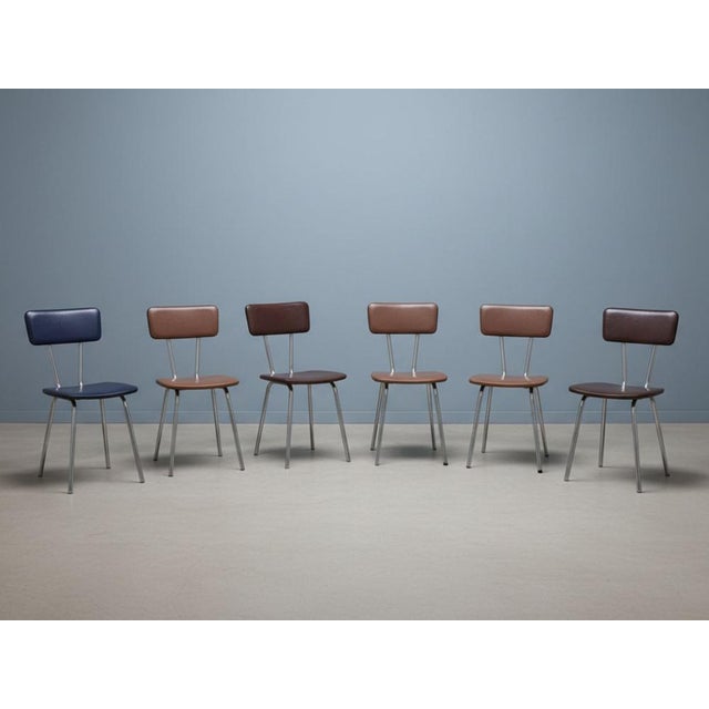 Set of six dining chairs from the 1960s, produced in Czechoslovakia. The design reflects the clean lines and functional...