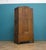 An oak hall cupboard dating to the late 1920s / early 1930s, finished in a light limed oak that highlights the natural...