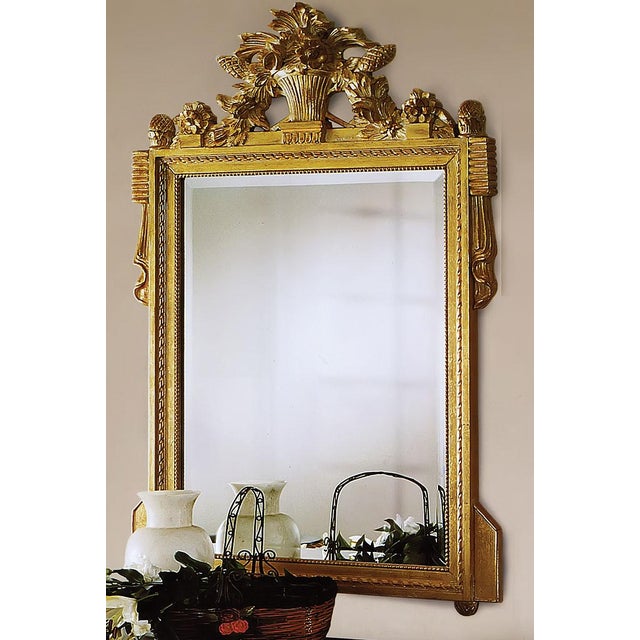 Handcrafted in Italy, this wall mirror features a solid beechwood frame with hand-carved details and a decorative crest....