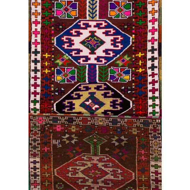 Beautiful vintage Turkish Hand-knotted wool runner with a ruby-red field. This rug has multi-color accents in an all-over...