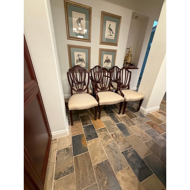 Set of 6 Mahogany Baker Federal style Dining Chairs.The set includes 2 arm chairs and 4 side chairs upholstered in a pale...