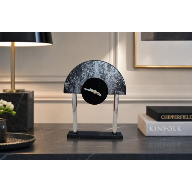 An exclusive table clock with a sophisticated design, made in italy by creazioni g & f for their "exclusive collection." a...