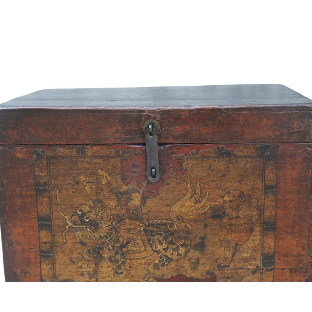 Antique Chinese Painted Chest, the lacquered worn chest front showing a golden foo lion being ridden by a nobleman....