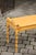 Vintage English Midcentury Goldenrod Painted Wooden Bench with Black Accents For Sale - Image 9 of 11