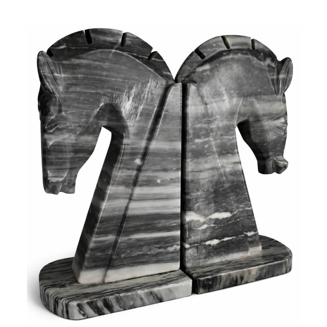 A dramatic pair of mid-century carved marble horse bookends. Each hand-carved horse leans forward with sculptural tension,...