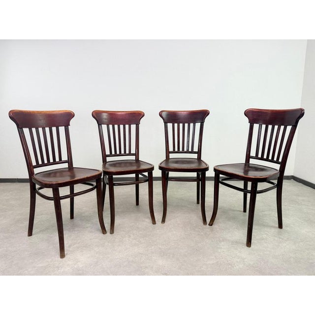 A rare opportunity to acquire a complete, matching set of 10 authentic bentwood dining chairs by the world-renowned...