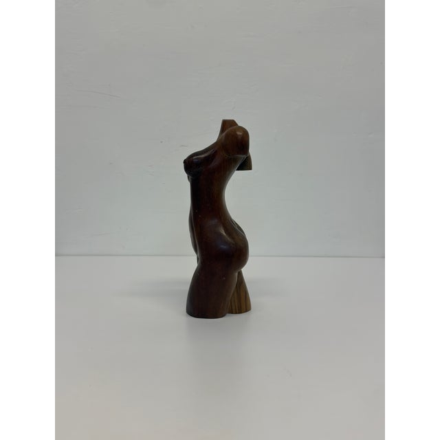 Hand-carved female torso by unknown artist in solid hard wood circa 1960s.
