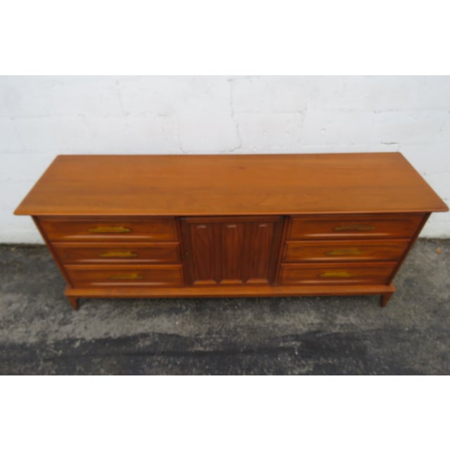 This magnificent Dresser is made of wood, solid wood, solid cherry, and metal. The Dresser is stamped Unique Furniture...