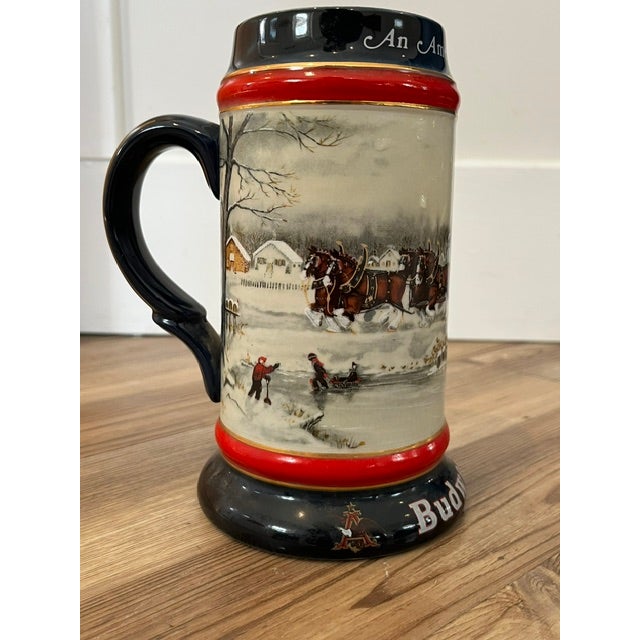 Susan Renae' Sampson (signed on the front)Design: Features a team of Budweiser Clydesdales pulling a red holiday wagon...