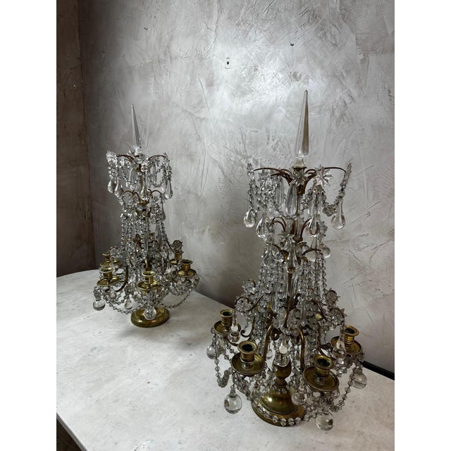 Superb pair of Louis XVI style girandoles/candelabra in gilt bronze and cut crystal. These elegant pieces feature a finely...