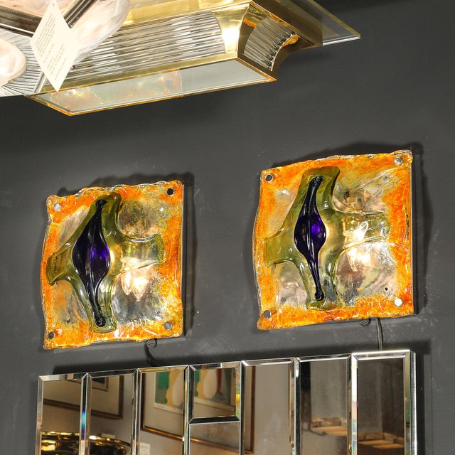 A mesmerizing pair of hand-blown Murano glass sconces by the acclaimed Italian glassmaker Mazzega, these sculptural works...