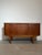 A beautifully proportioned mid-century modern sideboard by Jentique, crafted in richly figured teak and showcasing the...