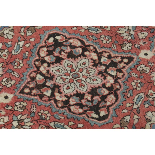 Hand-knotted in fine wool and originating circa 1920-1929 from Persia, this antique 3x2 gift-sized Persian Farahan rug...