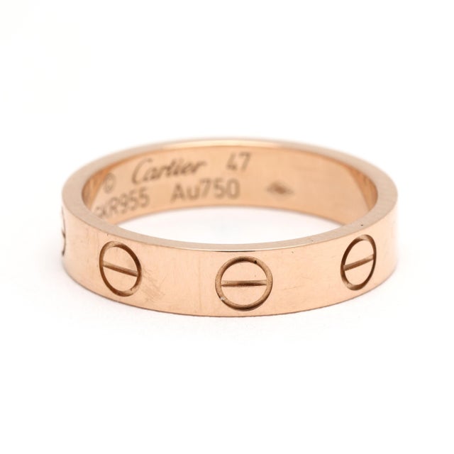 Ring Size: 47 / US 4.25 Rise Off Of Finger: 1.1 mm Width: 3.6 mm Weight: 1.9 dwts/ 2.9 grams Metal: "750 Cartier *Love...