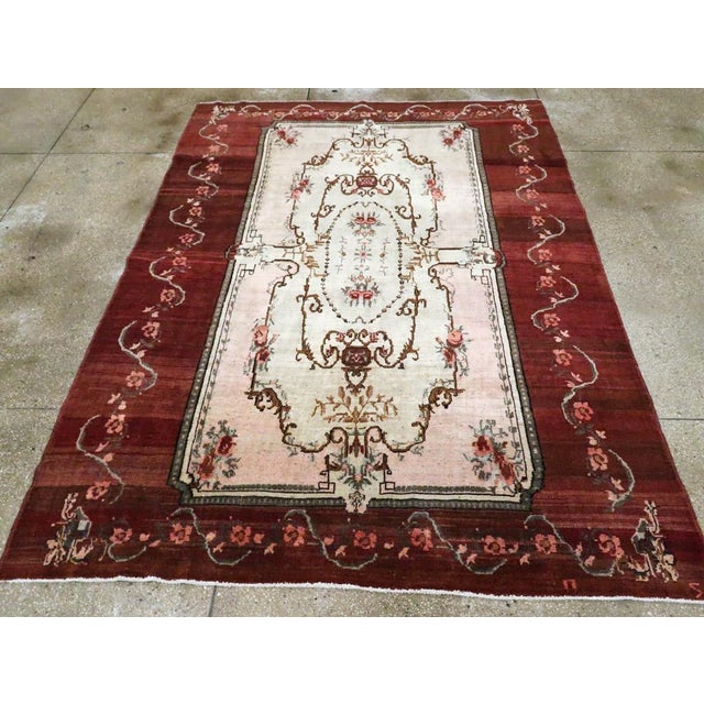 A French Inspired Vintage Turkish Anatolian accent carpet handmade during the Mid-20th century. Measures: 7' 2" x 9' 8"