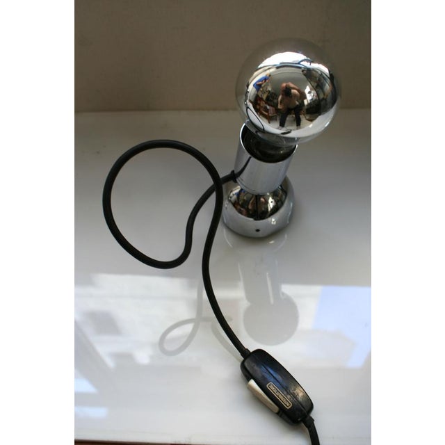 Pollux wall or table lamps designed by Ingo Maurer, Germany 1973. The lamp is entirely made of chromium-plated steel. Both...