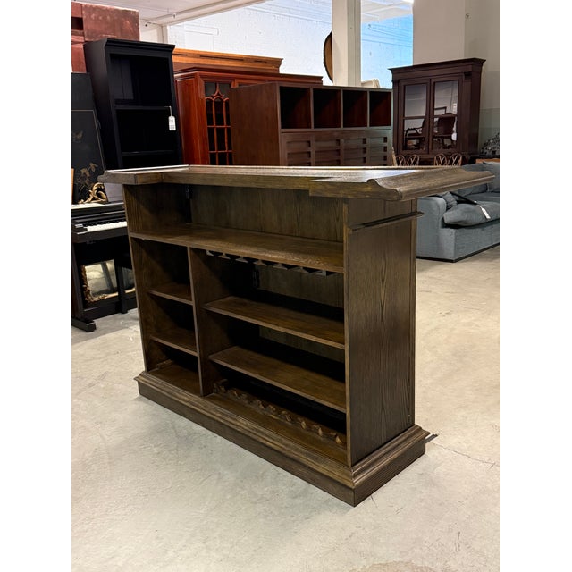 Design Plus Gallery presents the Valore Home Bar from American Heritage. The wood construction has a Riverbank tone,...