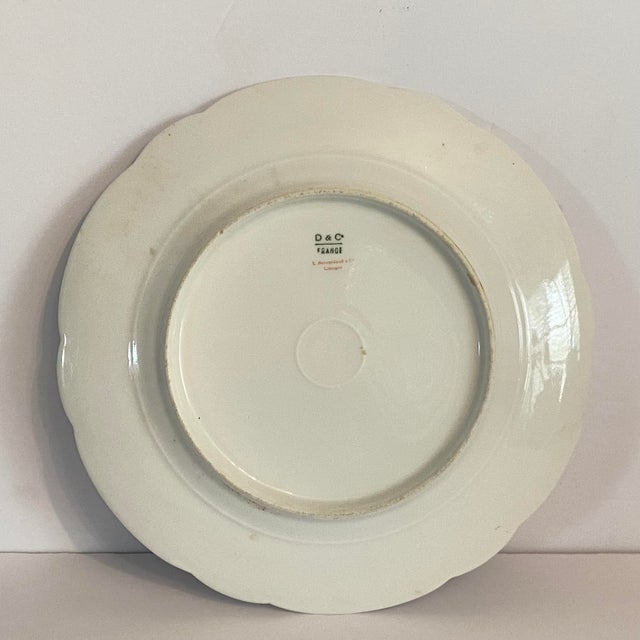Pretty Limoges scallop edge plate white with pink roses and gold accents. Green Mark: The underglaze "D & C / FRANCE" mark...