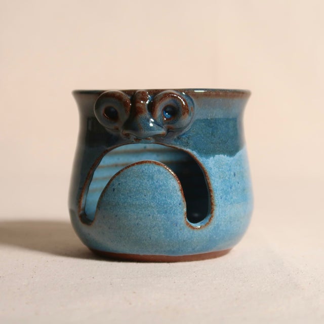 A charming handmade MudWorks Pottery candle holder from Effort, Pennsylvania, featuring the studio's beloved playful...