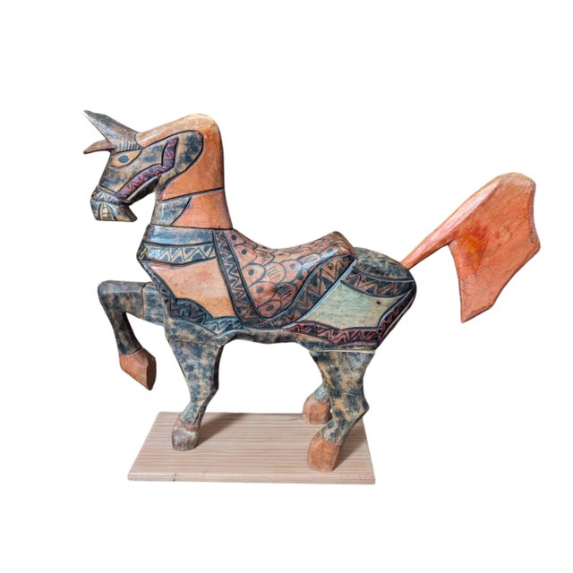 This vintage, hand-carved and painted wood horse has style in spades. Featuring rich earthen hues of terracotta, black and...