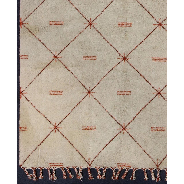 Measures: 9 x 12. Keivan Woven Arts. Vintage Large Moroccan rug with Ivory background with orange, red, brown and black...