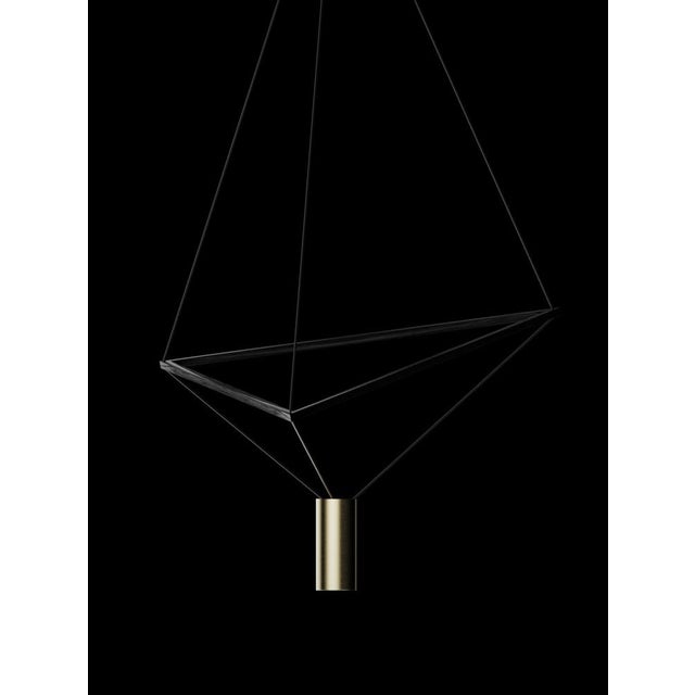 Ceiling lamp with black wood structure and brushed brass lampshade. The wooden triangular structure can be freely tilted...