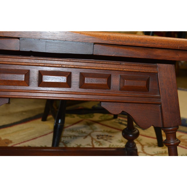 This is a solid & well made extending coffee table. Carved trim & turned spay legs. Side stretchers. The 2 ends extend...
