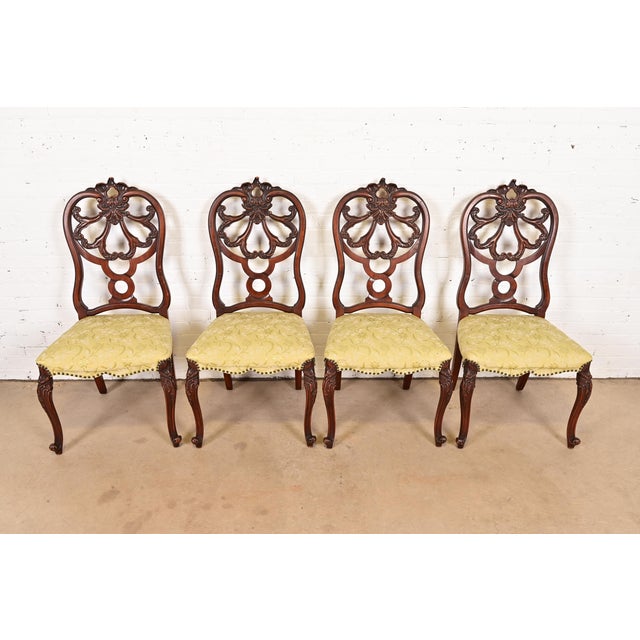An outstanding set of four antique French Provincial Louis XV style dining chairs By Romweber USA, Circa 1920s Carved...