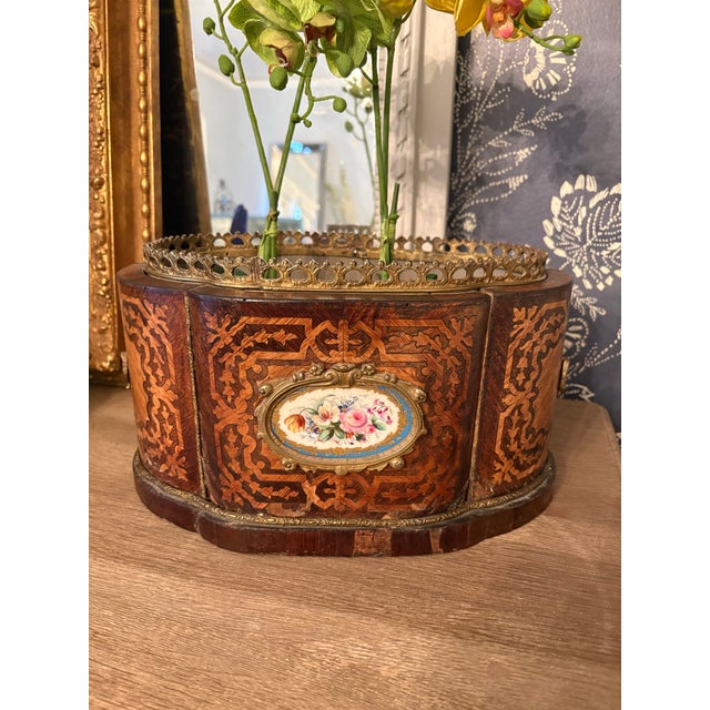 (French, early to mid 20th century) A lobed form marquetry Napoleon III parquetry and Sevres style jardiniere/planter with...