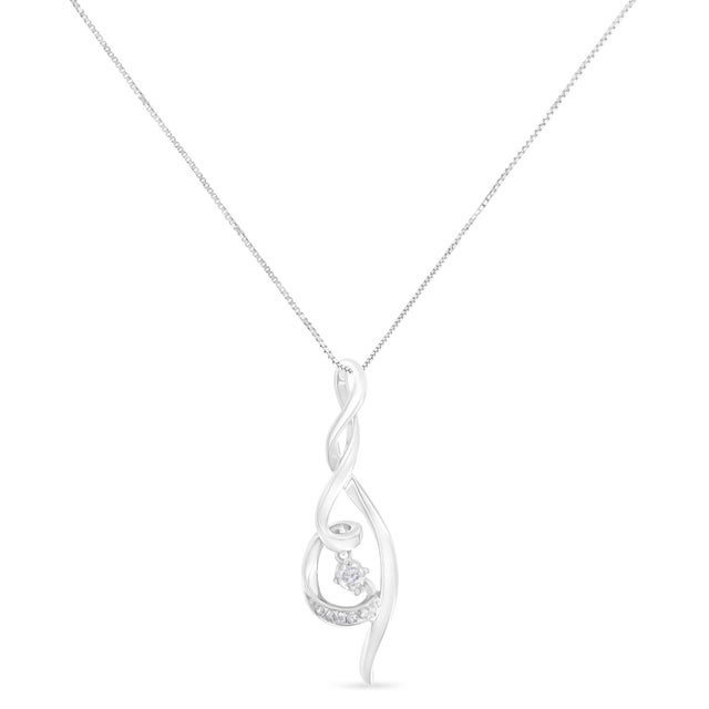 Fancy swirls of 10 karat white gold, elegantly lined with diamonds makes this accessory a meaningful yet timeless jewel....