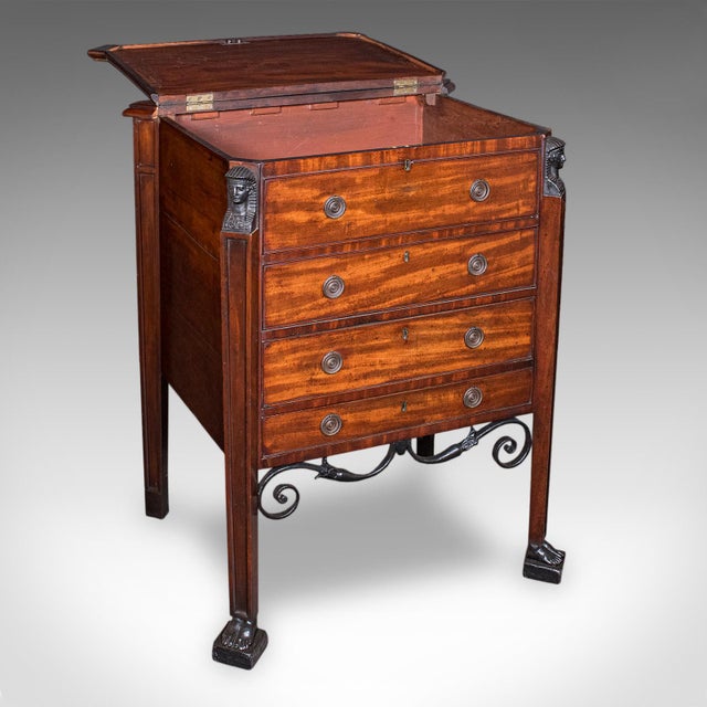 This is an antique cocktail cabinet. An English, mahogany and cast iron Great Exhibition era drinks stand in Egyptian...