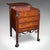This is an antique cocktail cabinet. An English, mahogany and cast iron Great Exhibition era drinks stand in Egyptian...