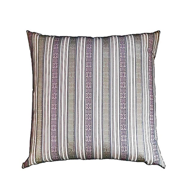 A square accent pillow, made out of hand-woven Bhutan raw silk, contemporary. Known as Thagzo, Bhutanese hand-weaving...