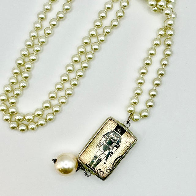 Ivory 1990s Vintage Chippendale Art Deco Nutcracker Babble on Faux Pearls Christmas Pendant Necklace, 40” For Sale - Image 8 of 17