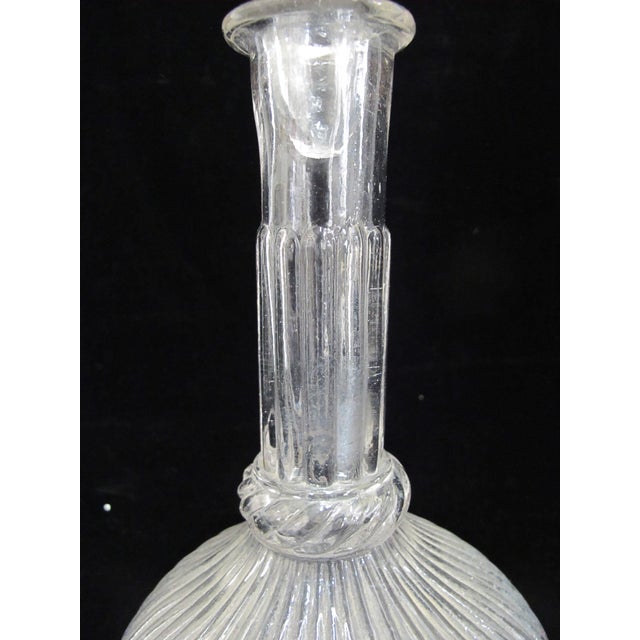 Lovely 18th century blown glass decanter in hot air balloon style with heavily ribbed stopper and bulbous base. Measures...