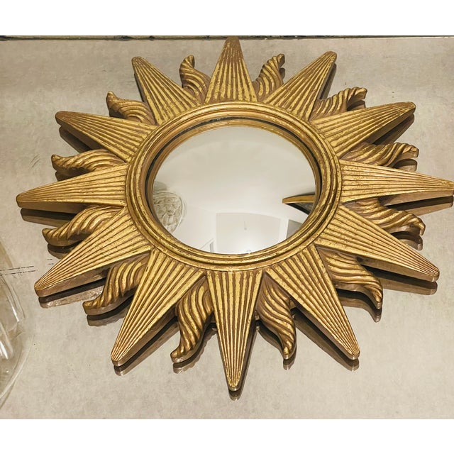 Vintage convex sunburst gold mirror. 12”