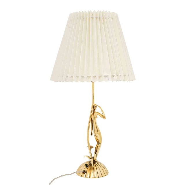 Table lamp with lady and flowers, karl hagenauer, werkstatte hagenauer vienna, circa 1930, brass cast and polished, marked...