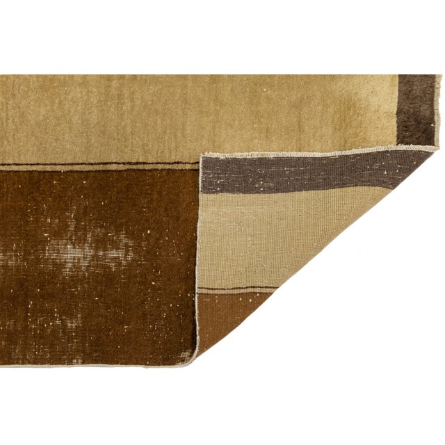 This striking antique Chinese runner showcases the sophisticated minimalism often associated with the Art Deco movement of...
