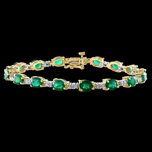 This exceptionally affordable Tennis bracelet has 16 stones of oval Emeralds . Each Emerald is spaced by two diamonds ....