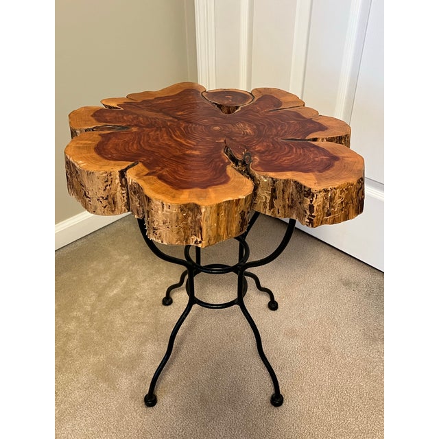 A very thick slab of live edge wood serves as the top to this iron base side table. Just the right size. Maker unknown,...