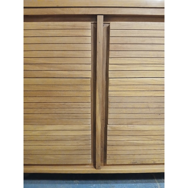 An exceptional artisan-crafted Mid-Century Modern six-drawer lowboy dresser, constructed entirely from highly figured,...