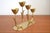 This four-armed brass candlestick was designed by Gunner Ander in the 1960s and manufactured for Ystad Metall in Sweden....