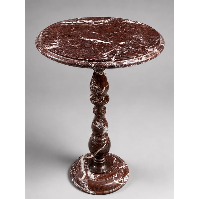 Elevate your space with this exquisite handcrafted rosso levanto marble pedestal side table, featuring rich burgundy tones...