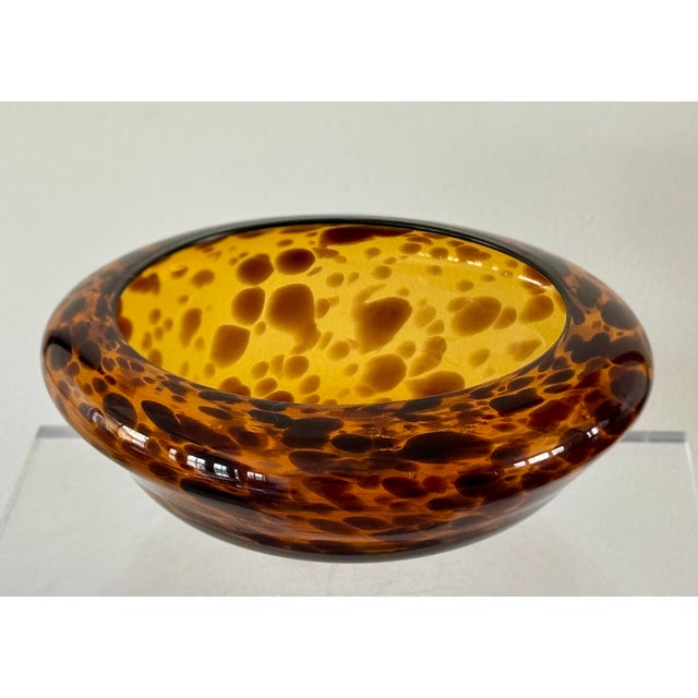 A hand blown bowl of tortoise shell patterned glass. The underside with polished pontil. Italian from the 70’s.