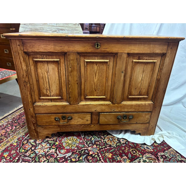 A 19th century English Pine Blanket Chest of great proportions, circa 1860, measuring only 43" wide with paneled front and...