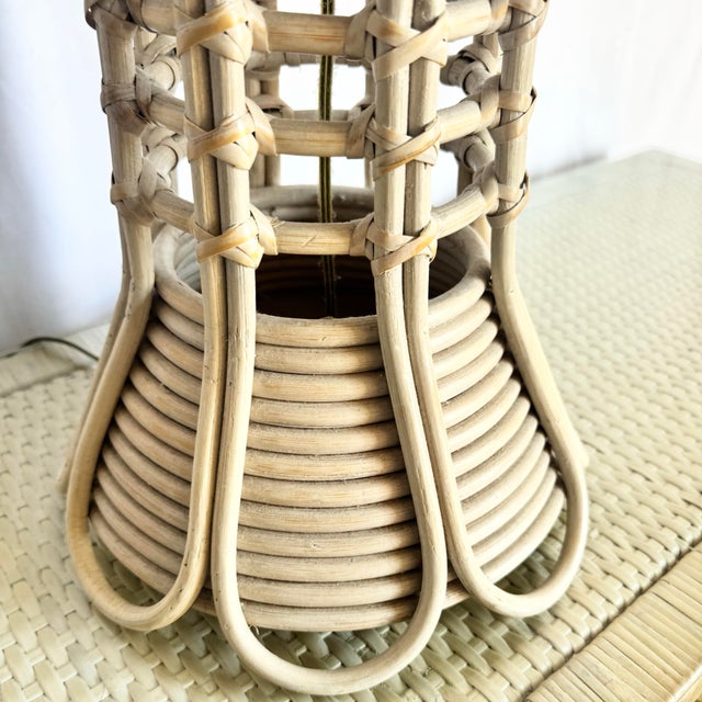 A sculptural expression of coastal bohemian style, this pencil reed rattan table lamp showcases graceful curves and open...