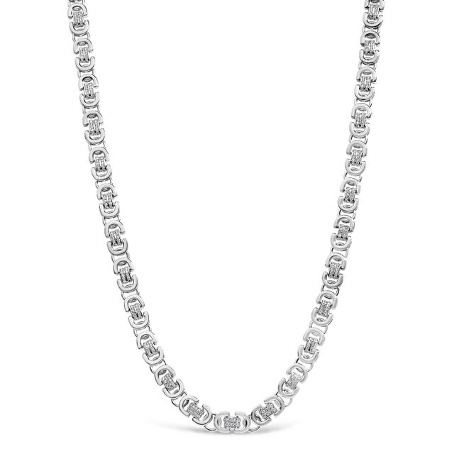 Crafted from the lustrous depths of .925 sterling silver, this men's necklace is a testament to both strength and...