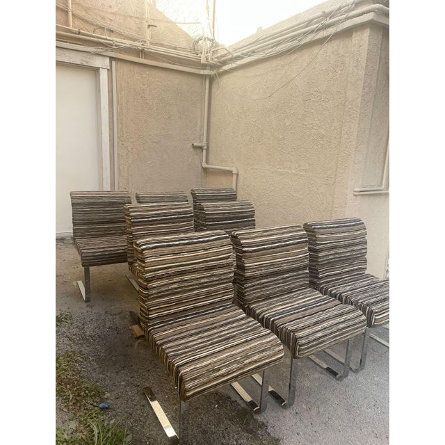 Rare set of eight cantilevered chairs by Mariani for Pace, featuring polished chrome frames in a classic cantilevered...