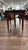 This vintage rustic wood drop-leaf dining table features a rich patina, rounded drop-down leaves, elegant turned legs, and...